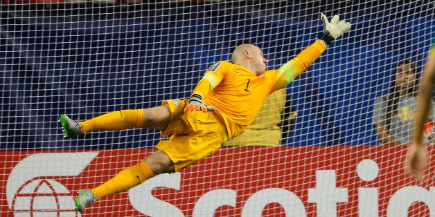 The ball gets past United States goalkeeper Brad Guzan for a Jamaica goal during the first half of a CONCACAF Gold Cup soccer semifinal. Wednesday, July 22, 2015, in Atlanta. (AP Photo/John Bazemore)