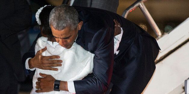 Eight year-old Joan Wamaitha greets President Barack Obama as he arrives at Kenyatta International Airport, on Friday, July 24, 2015, in Nairobi, Kenya. Obama is traveling on a two-nation African tour where he will become the the first sitting U.S. president to visit Kenya and Ethiopia. (AP Photo/Evan Vucci)