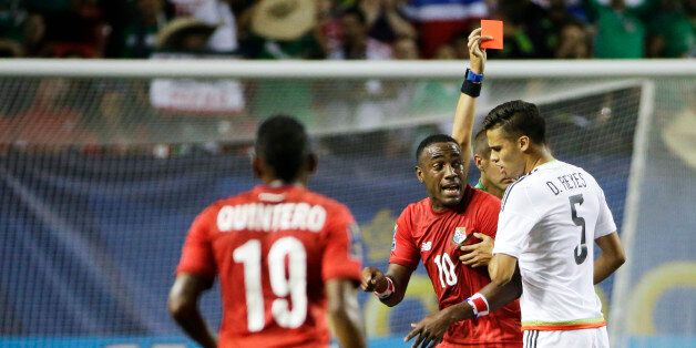 Panama's Luis Tejada (10) reacts after receiving a red card following a collision with Mexicoâs Francisco Rodriguez, left, as Mexicoâs Diego Reyes, right, watches during the first half of a CONCACAF Gold Cup soccer semifinal, Wednesday, July 22, 2015, in Atlanta. (AP Photo/David Goldman)