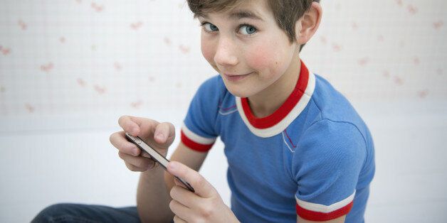 Boy holding a mobile phone