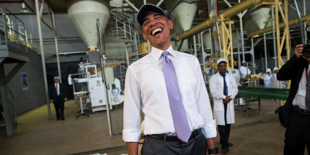U.S. President Barack Obama jokes with the media during a tour of Faffa Food, Tuesday, July 28, 2015, in Addis Ababa, Ethiopia. On the final day of his African trip, Obama is focusing on economic opportunities and African security. (AP Photo/Evan Vucci)