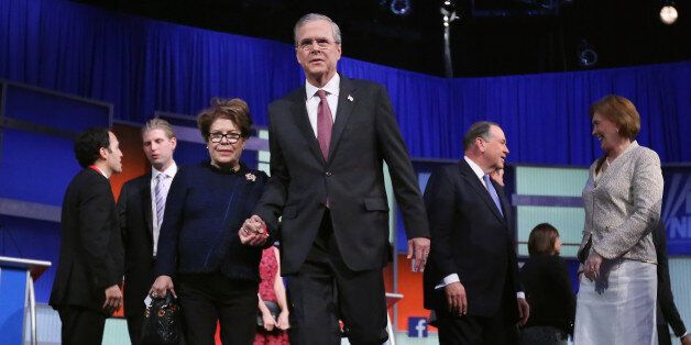 CLEVELAND, OH - AUGUST 06: Republican presidential candidate Jeb Bush (C) and his wife Columba Bush leave the stage after the first prime-time presidential debate hosted by FOX News and Facebook at the Quicken Loans Arena August 6, 2015 in Cleveland, Ohio. The top-ten GOP candidates were selected to participate in the debate based on their rank in an average of the five most recent national political polls. (Photo by Chip Somodevilla/Getty Images)