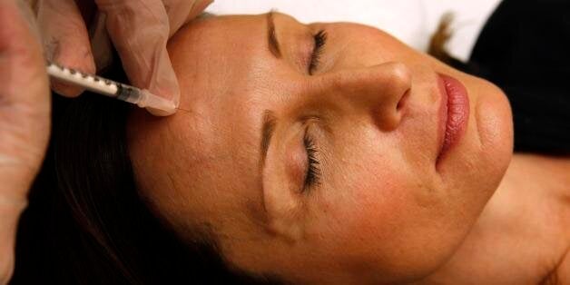 Colleen Delsack, 47, of Alexandria, Va., has Botox injected by Dr. Shannon Ginnan, at Reveal in Arlington, Va. on Friday, June 5, 2009. Reveal is offering free injections of the anti-wrinkle drug Botox to the first 50 people who stop by Friday clutching a resume. The event will feature recruiters offering tips, networking opportunities and on-site interviews. And, of course, there's also this pitch: Confidence inspired by Botox could give job seekers an edge in the hiring process. (AP Photo/Jacquelyn Martin)