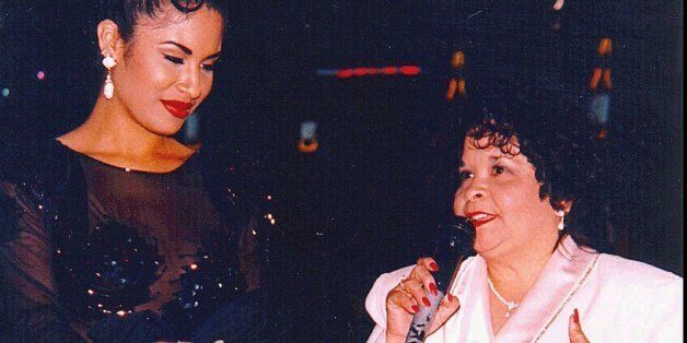 Tejano star Selena, left, watches as Yolanda Saldivar speaks to a crowd at a post-1994 Tejano Music Awards party in San Antonio, Texas. Saldivar is accused of shooting Selena to death in a Corpus Christi motel room Friday, March 31, 1995. (AP Photo)
