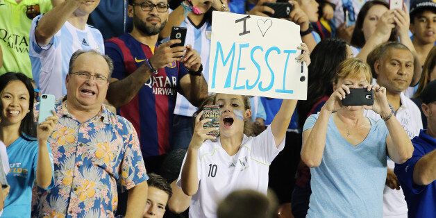 HOUSTON, TX - SEPTEMBER 04: Lionel Messi fans take photos from the stands of Messi on the field during the International friendly match between Argentina and Bolivia at BBVA Compass Stadium on September 4, 2015 in Houston, Texas. (Photo by Scott Halleran/Getty Images)