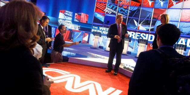 Sam Feist, Washington bureau chief and senior vice president for CNN, leads a tour of the debate stage before a Republican presidential debate sponsored by the network Tuesday, Oct. 18, 2011, in Las Vegas. (AP Photo/Isaac Brekken)
