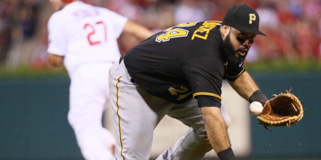 Pittsburgh Pirates first baseman Pedro Alvarez loses possession of the ball as he gets to his feet after stopping a line drive off the bat of the St. Louis Cardinals' Jason Heyward in the sixth inning on Thursday, Aug. 13, 2015, at Busch Stadium in St. Louis. The Pirates won, 10-5. (Chris Lee/St. Louis Post-Dispatch/TNS via Getty Images)
