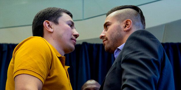 Middleweight boxers Gennady Golovkin, left, of Kazakhstan, and David Lemieux, of Canada, pose together during a news conference Tuesday, Aug. 18, 2015, in New York, to promote their middleweight world championship title unification bout set for Saturday, Oct. 17, 2015, at Madison Square Garden. At rear center is boxer Bernard Hopkins. (AP Photo/Craig Ruttle)
