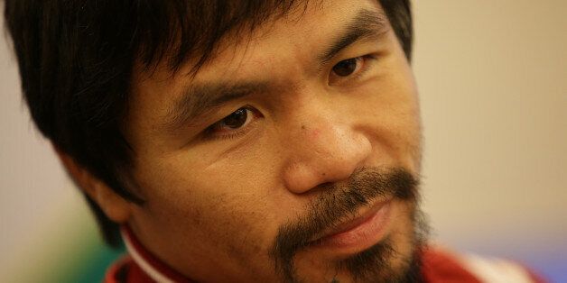 Filipino boxing icon Manny Pacquiao listens to questions during an interview in suburban Pasay, south of Manila, Philippines on Wednesday, Sept. 16, 2015. Pacquiao said boxing is not his main focus these days and a rematch with Floyd Mayweather may not happen because the American champion said he was retiring. (AP Photo/Aaron Favila)