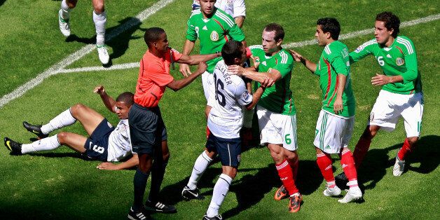 MEXICO CITY, MEXICO - AUGUST 12: Mexico's Gerardo Torrado (C) and Benny Feilhaber of the United States argue during their 2010 FIFA World Cup qualifying soccer match at the Azteca Stadium on August 12, 2009 in Mexico City, Mexico. (Photo by Juan Villa/Jam Media/LatinContent/Getty Images)