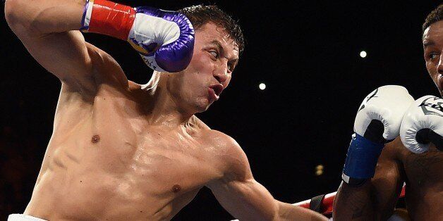 Boxer Gennady Golovkin (L) from Kazakhstan prepares to land a punch on Willie Monroe Jr. of the US in the second round during their Middleweight World Championship bout at the Forum Arena in Los Angeles, California on May 16, 2015. Golovkin won the fight by knocking out Monroe Jr. in the sixth round. AFP PHOTO / MARK RALSTON (Photo credit should read MARK RALSTON/AFP/Getty Images)