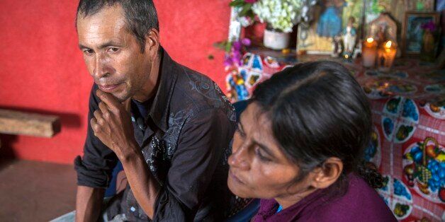 Francisco Ramos Diaz, left, and Cipriana Juarez Diaz, parents of Gilberto Francisco Ramos Juarez, a Guatemalan boy whose decomposed body was found in the Rio Grande Valley of South Texas, pause during an interview at their home in San Jose Las Flores in northern Cuchumatanes mountains, Guatemala, Tuesday, July 1, 2014. The number of unaccompanied immigrant children picked up along the border has been rising for three years as they flee pervasive gang violence in Honduras, Guatemala and El Salvador. (AP Photo/Luis Soto)