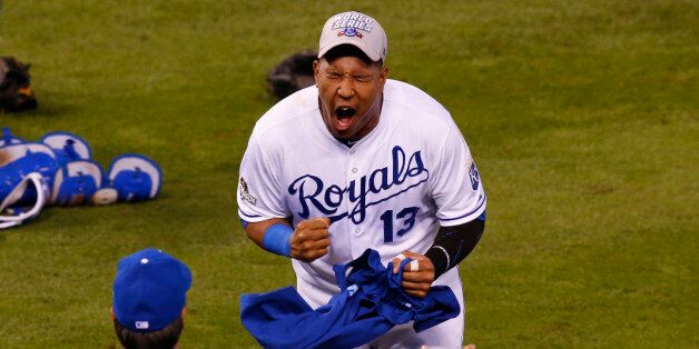 Kansas City Royals catcher Salvador Perez celebrates after beating the Toronto Blue Jays 4-3 in Game 6 of the American League Championship baseball series in Kansas City, Mo., Friday, Oct. 23, 2015. The Kansas City Royals advance to the World Series to play the New York Mets. (AP Photo/Paul Sancya)
