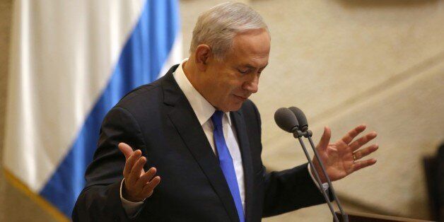 Israeli Prime Minister Benjamin Netanyahu gestures as he delivers a speech during a special Knesset session in memory of late Israeli prime minister Yitzhak Rabin in Jerusalem on October 26, 2015 as Israel marks the 20th anniversary of the assassination of the Nobel Peace laureate, who led the way in the effort towards peace between Israelis and Palestinians. Rabin was assassinated on November 5, 1995 during a peace rally in Tel Aviv by a Jewish extremist. AFP PHOTO / GALI TIBBON (Photo credit should read GALI TIBBON/AFP/Getty Images)