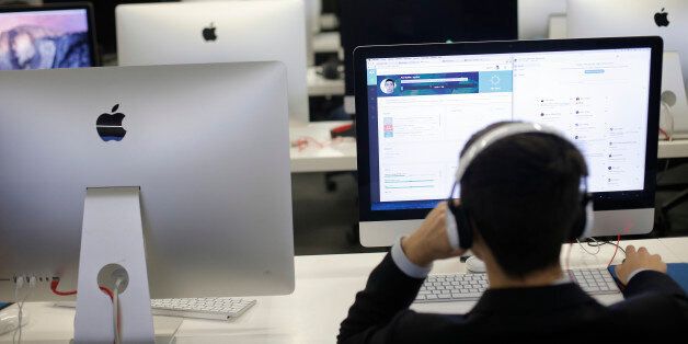 Students works in the Ecole 42 digital school, founded by provider of phone, Internet and TV services group Iliad SA's chairman Xavier Niel, Tuesday Oct.27, 2015 in Paris. (AP Photo/Thibault Camus)