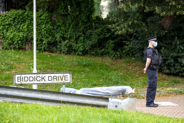 A police officer stands guard at the the scene on Biddick Drive following a shooting in Keyham.
