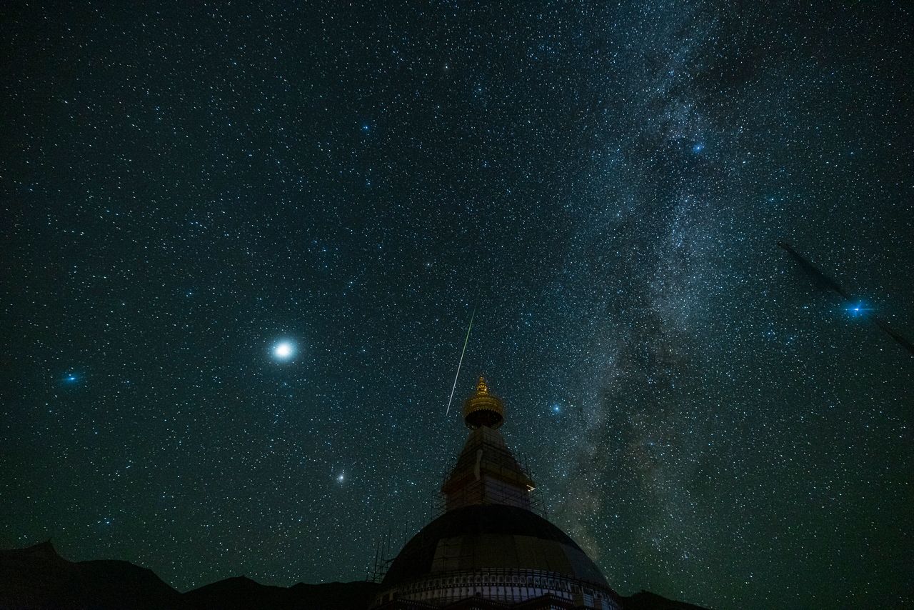 Perseid meteors streak over sky on August 13, 2021 in Golog Tibetan Autonomous Prefecture, Qinghai Province of China