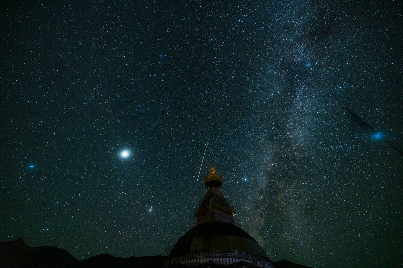 Perseid meteors streak over sky on August 13, 2021 in Golog Tibetan Autonomous Prefecture, Qinghai Province of China