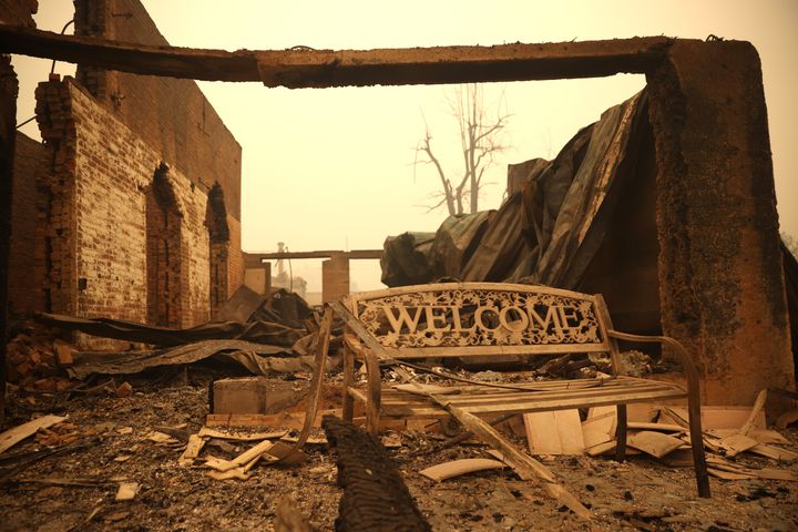 T 11: A bench sits in front of a property that was destroyed by the Dixie Fire on Aug. 11, 2021 in Greenville, California. 