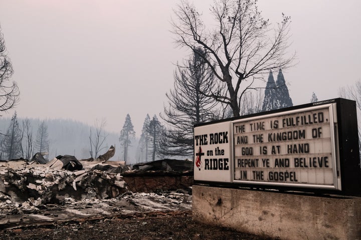 The remains of a burned church destroyed by the Dixie Fire is situated along Highway 89 on Aug. 8, 2021 in Greenville, Califo