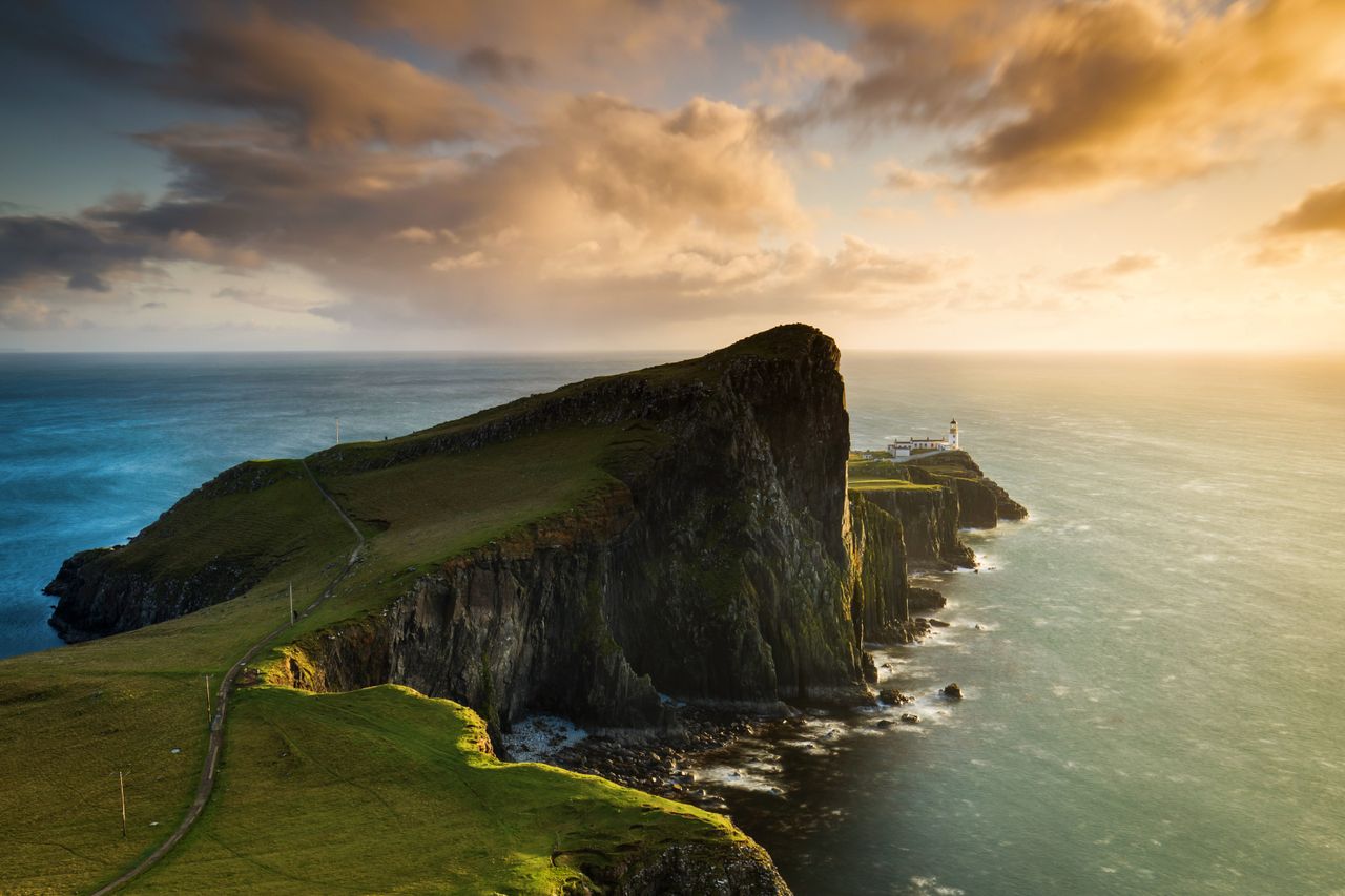 Neist Point and the lighthouse on Isle of Skye at sunset in Scotland, UK
