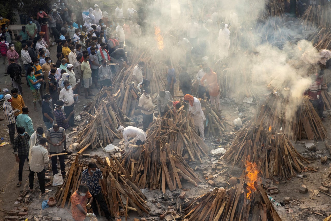 Amid the coronavirus pandemic, images like this one — of smoldering crematorium grounds in New Delhi, captured in April this year — have become a common sight.