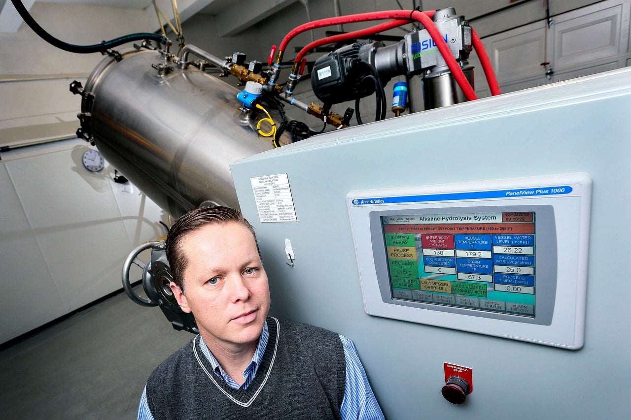 Trevor Charbonneau, a funeral home owner in Toronto, with his company's alkaline hydrolysis machine.