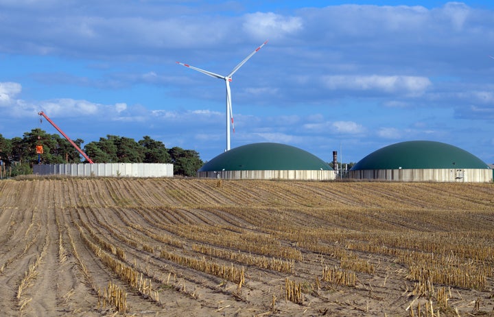 A biogas plant in Brandenburg, Germany, and the corn field that fuels it.