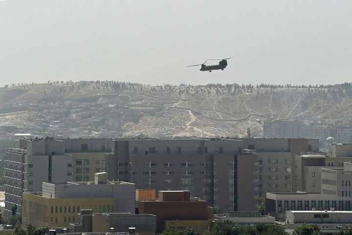 A US military helicopter is pictured flying above the US embassy in Kabul.