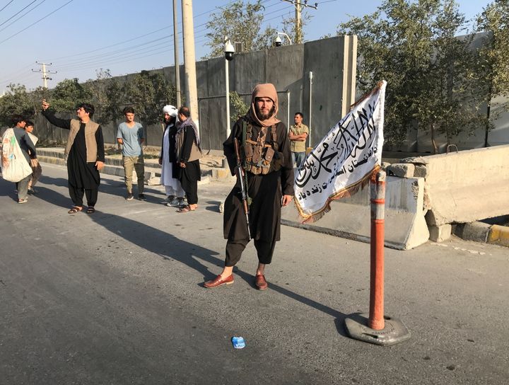 A member of Taliban stands outside the Interior Ministry in Kabul. 