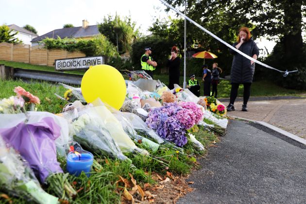 Members of the public place flowers at the entrance of Biddick Drive, where Davison began his killing...