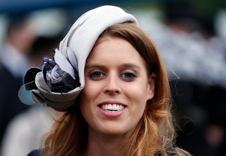 Princess Beatrice smiles during a garden party held at Buckingham Palace on May 30, 2013, in London.