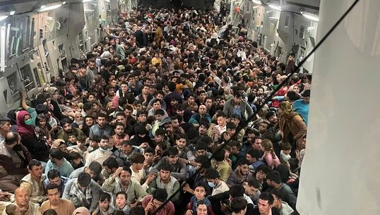 Extraordinary Photo Shows 640 Afghans Fleeing Kabul On Packed US