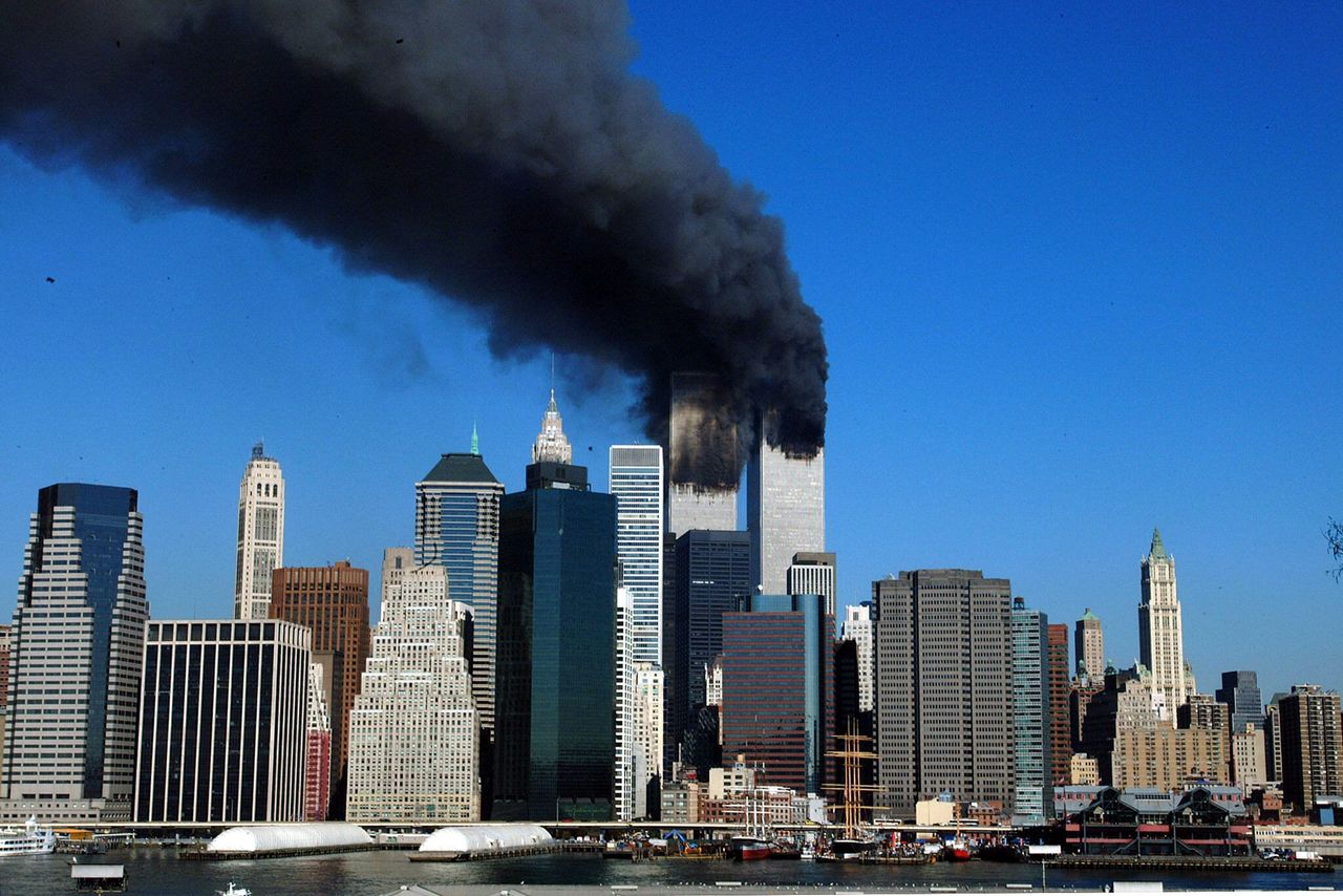 The twin towers of the World Trade Center billow smoke after hijacked airliners crashed into them early 11 September, 2001