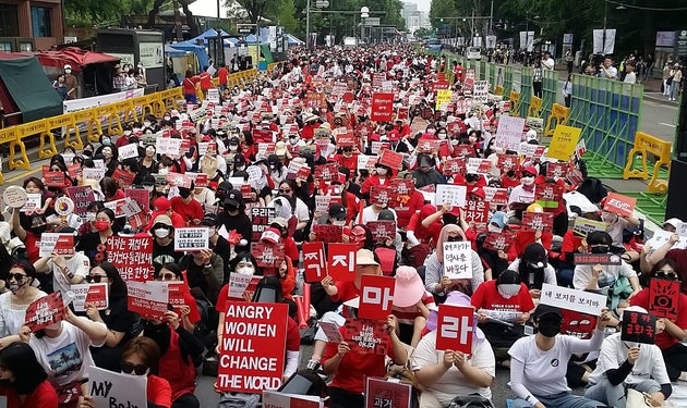 This picture taken on June 9, 2018 shows South Korean women staging a monthly protest against secretly-filmed...