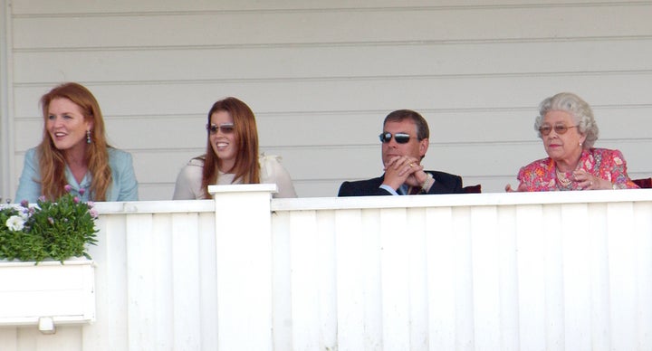 The Duke and Duchess of York, their daughter Princess Beatrice, and Queen Elizabeth attend the Queen's Cup polo match in Wind