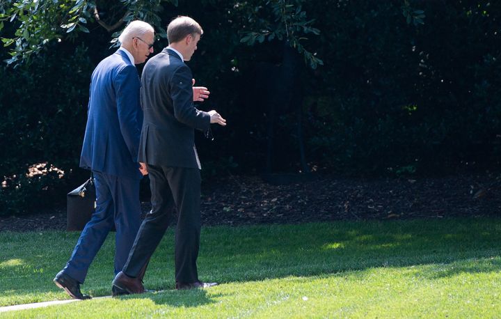 President Joe Biden walks with national security adviser Jake Sullivan to the Oval Office on July 27. Sullivan said Tuesday that the State Department had been advising U.S. citizens to leave Afghanistan for weeks but that some had declined. 