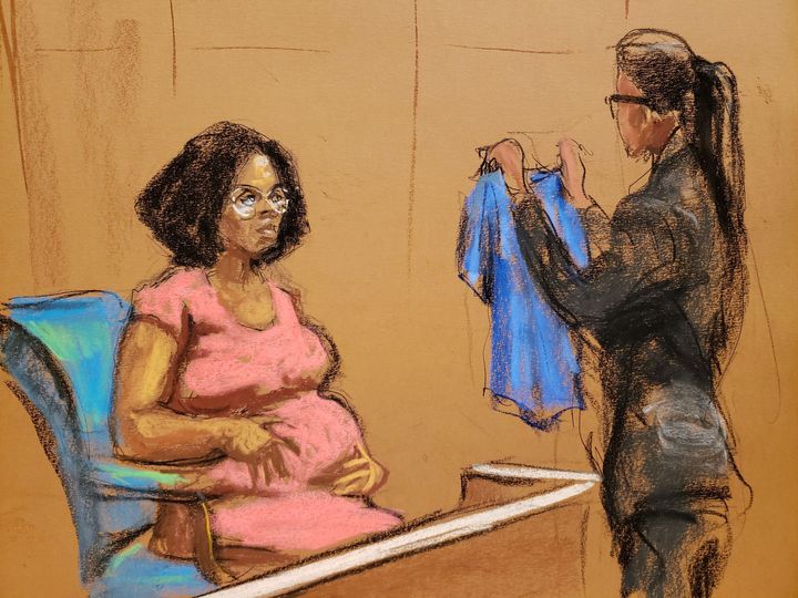 In a courtroom sketch, Jerhonda Pace is shown a shirt she had worn as she is questioned in the trial of singer R. Kelly in Brooklyn's Federal District Court in New York on Wednesday.