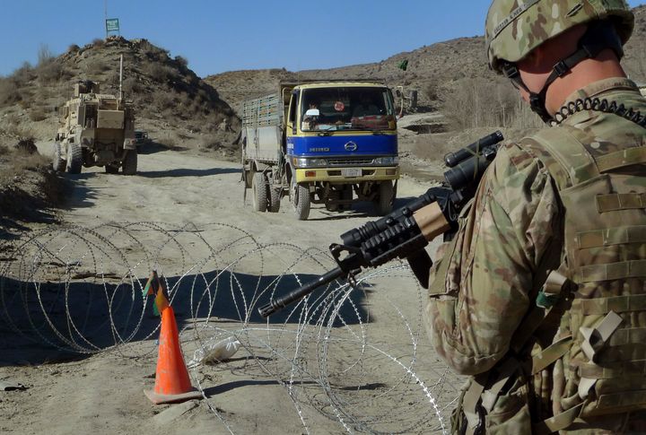 In this Dec. 1, 2011, file photo, a U.S. soldier with Apache Company of Task Force 3-66 Armor, out of Grafenwoehr, Germany, s