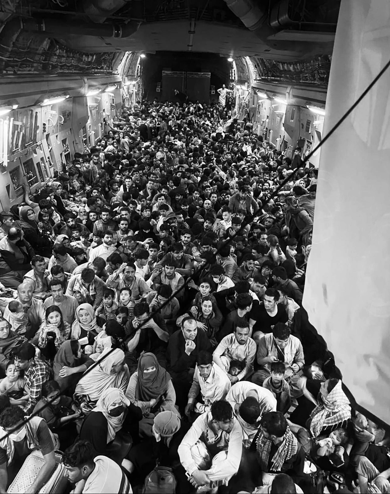 Afghan citizens are packed inside a U.S. Air Force C-17 Globemaster III as they're transported from Hamid Karzai International Airport in Afghanistan last Sunday.