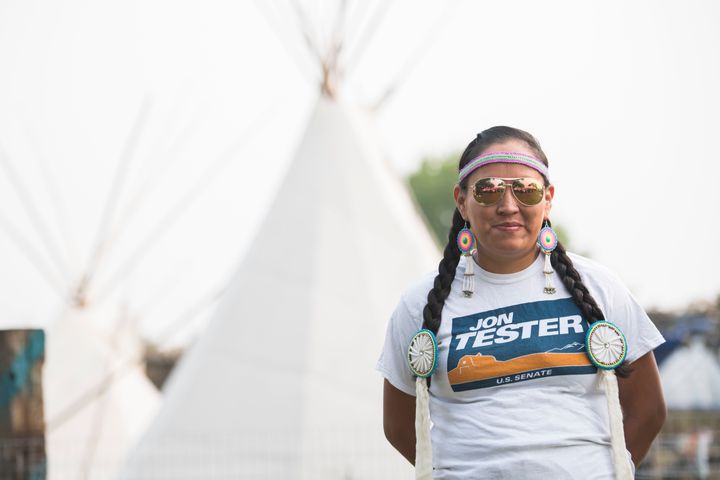 A campaign worker for Sen. Jon Tester (D-Mont.), a co-sponsor of the Native American Rights Act, attends the Crow Fair in Crow Agency, Montana, on Aug. 19, 2018.