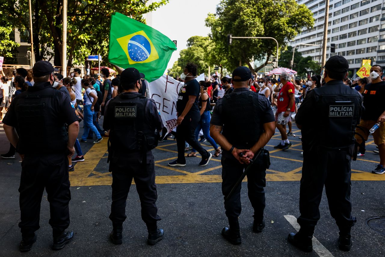 Rio de Janeiro police officers monitor a demonstration against Bolsonaro's handling of the COVID-19 pandemic. Brazil's police forces are heavily aligned with Bolsonaro. 