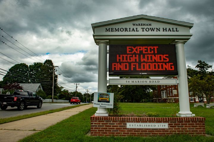 A sign outside the local Town Hall warns people to prepare for high winds and flooding as the impeding Tropical storm Henri expected to make landfall as a Hurricane on Sunday, approaches in Wareham, Massachusetts on August 20, 2021. 