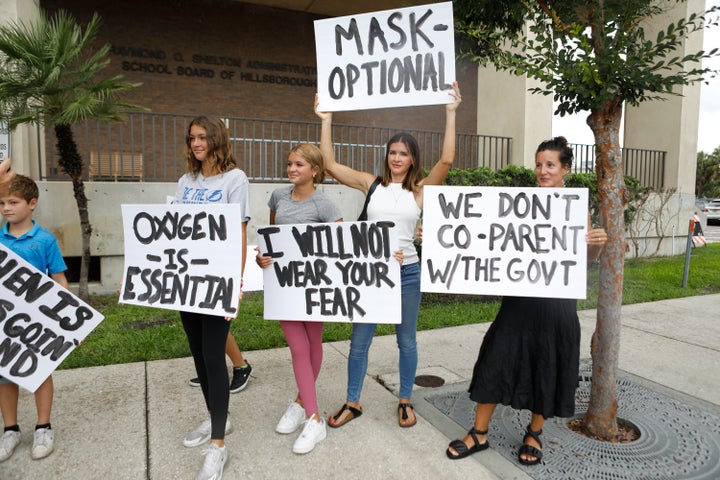 Families protest any potential mask mandates before the Hillsborough County Schools Board meeting held at the district office on July 27, 2021 in Tampa, Florida. 