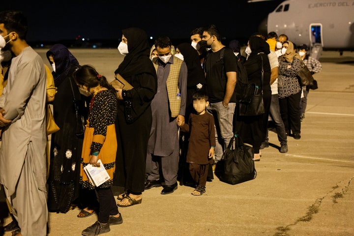 Passengers disembark a plane in Spain after evacuating from Kabul on Aug. 19. The plane, sent by the government of Spain, repatriated a first group of 55 Spaniards and Afghan collaborators.