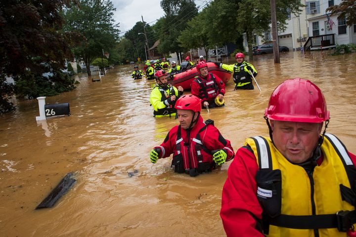 Members of the New Market Volunteer Fire Company perform a secondary search during an evacuation effort following a flash flood in Helmetta, New Jersey, on Aug. 22, 2021.