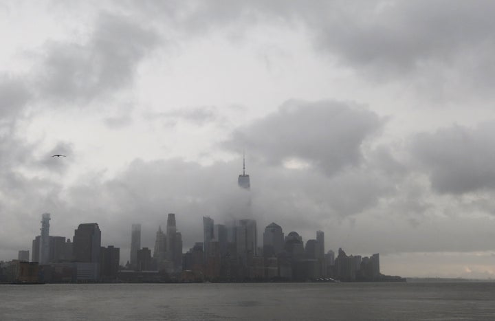 The remnants of storm system Henri pass through lower Manhattan in New York City on Aug. 22 2021 as seen from Hoboken, New Jersey.