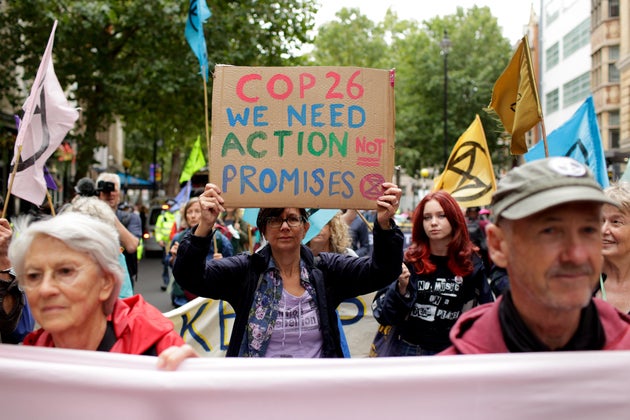 Members of climate change activist movement Extinction Rebellion march along Charing Cross Road on August...