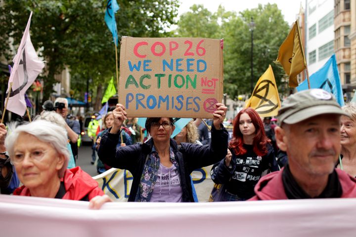 Members of climate change activist movement Extinction Rebellion march along Charing Cross Road on August 23, 2021