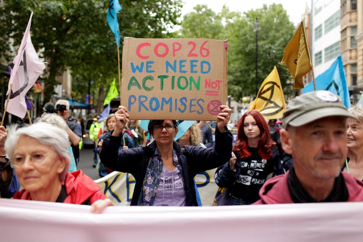 Members of climate change activist movement Extinction Rebellion march along Charing Cross Road on August 23, 2021